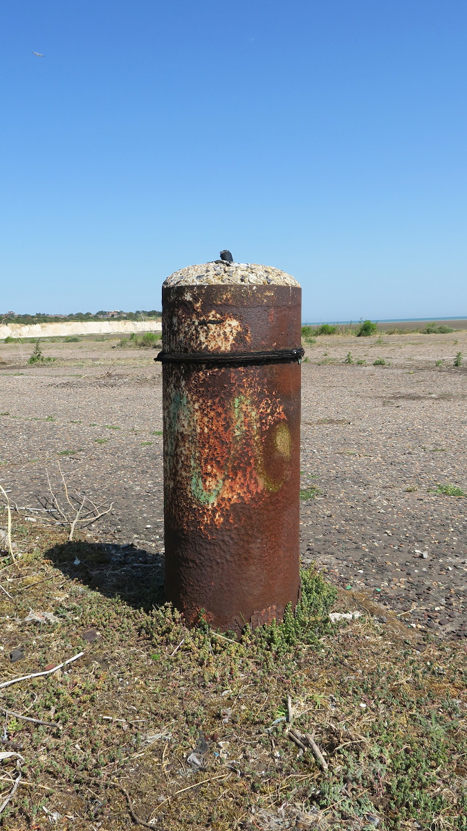 At point 3 we move to the car park. The markings from the bays are still visible as are the bases to the lighting lamp posts. It’s also the point where the only surviving evidence of buildings can be found (point 4 on the mastersheet). This was the car check-in centre.