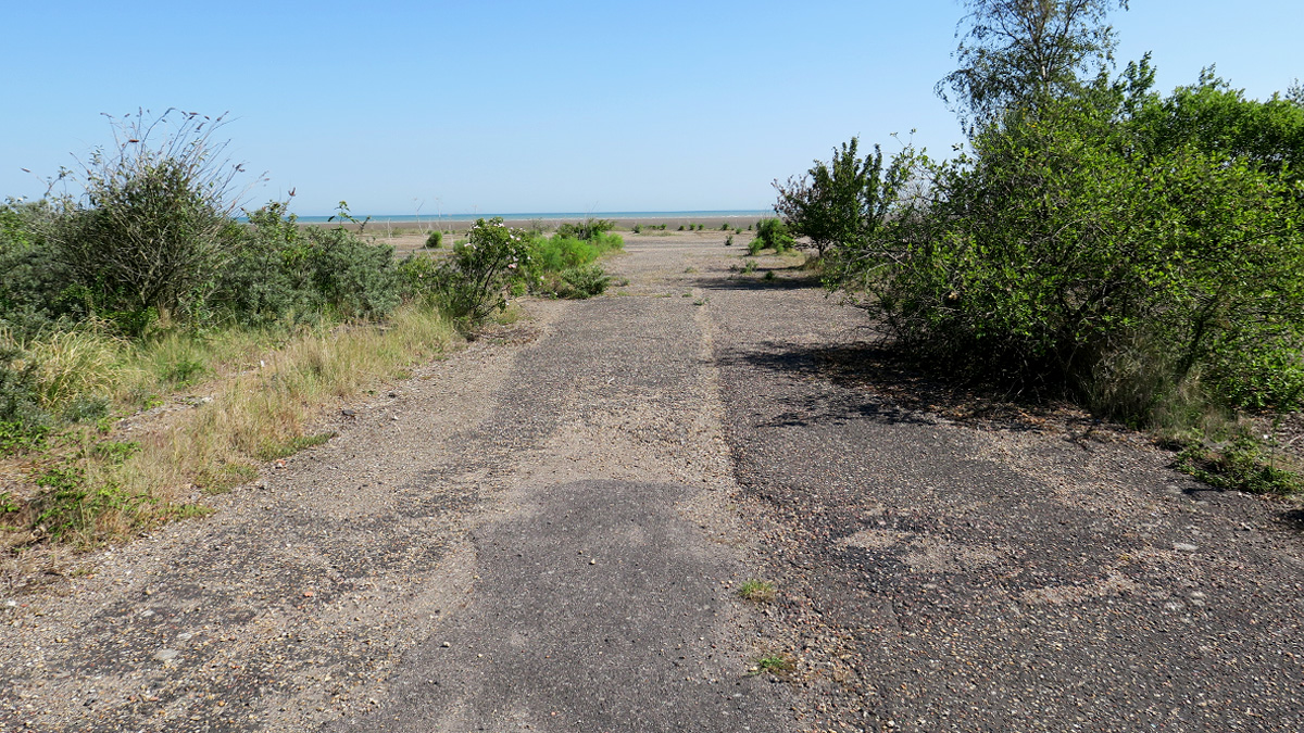 From ground level photo 1 shows where the front of a hovercraft undergoing maintenance would have been. Photo 2 shows the small passageway that would have run between the two hovercraft in maintenance.