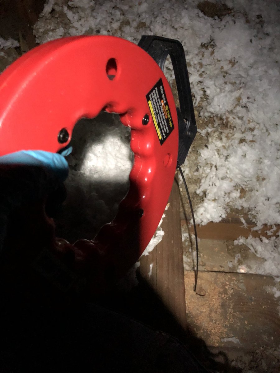 I used the hook to pull the pull the fish tape back into the garage. Then taped the Romex wire to the fish tape to pull it into the attic.