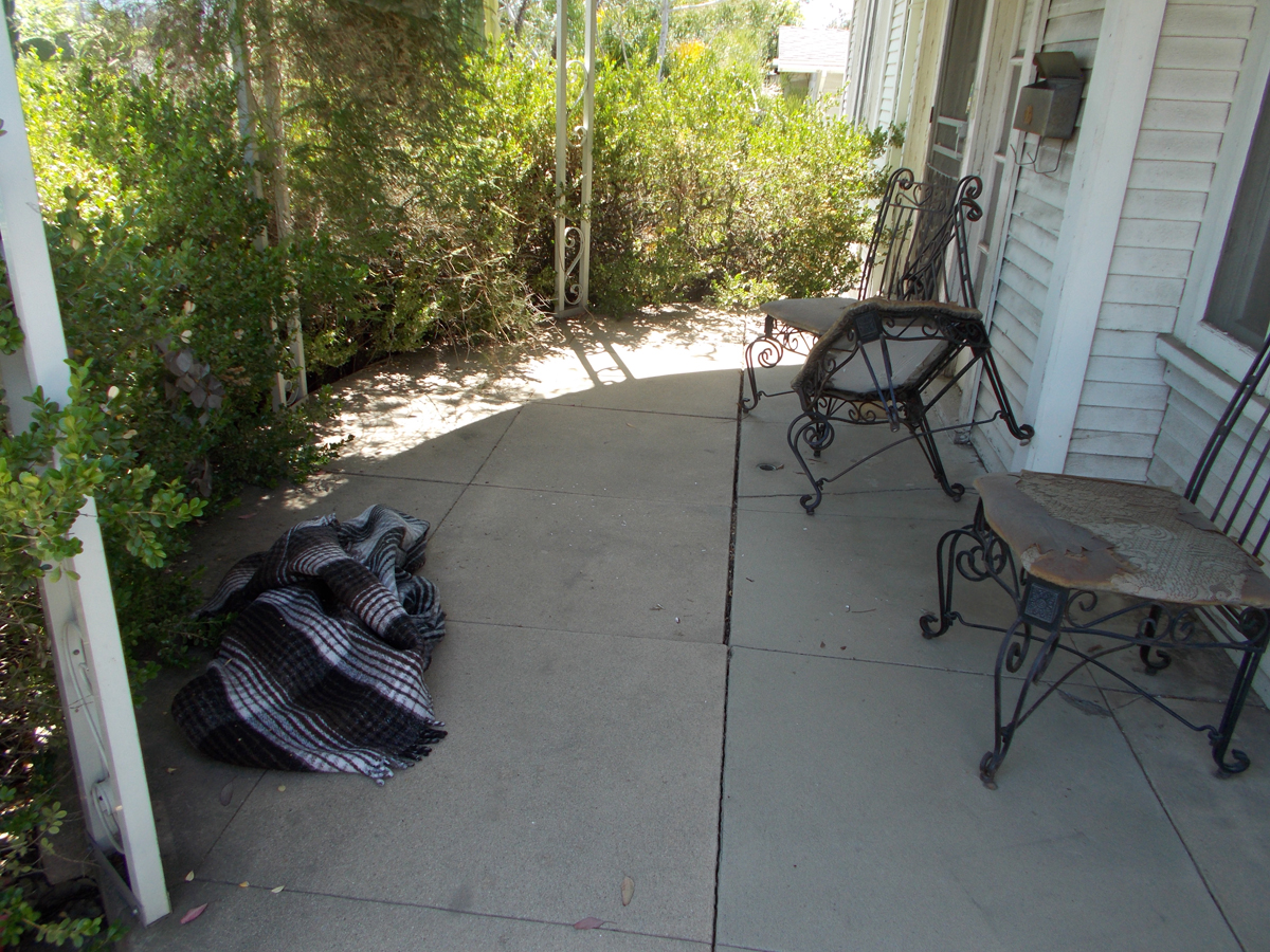 Then the woman attacked me.All 350 pounds of her. Waddling and shrieking.We went down the driveway and ended up on the porch.This is her serape. Each iron lawn chair weighs 50 pounds.