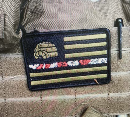 Eight days after the shooting at the federal courthouse, 80 miles south of Oakland, someone reported a white van apparently abandoned. Inside there were guns, ammo, explosive materials, and a tactical vest with this patch on it.