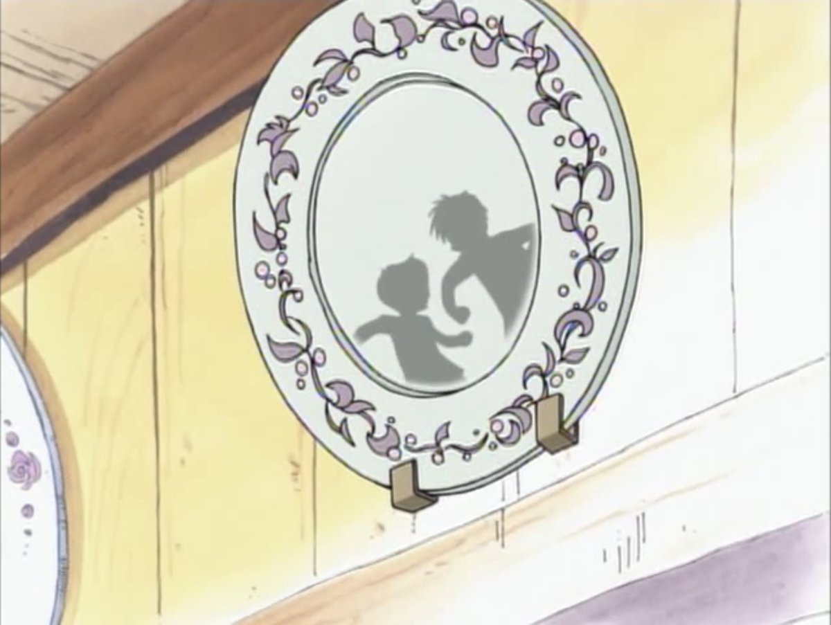 Interesting choice of a shot to not depict Luffy's beatdown on Coby, but to show their silhouettes reflected in a decorative plate in the restaurant. Less is more.