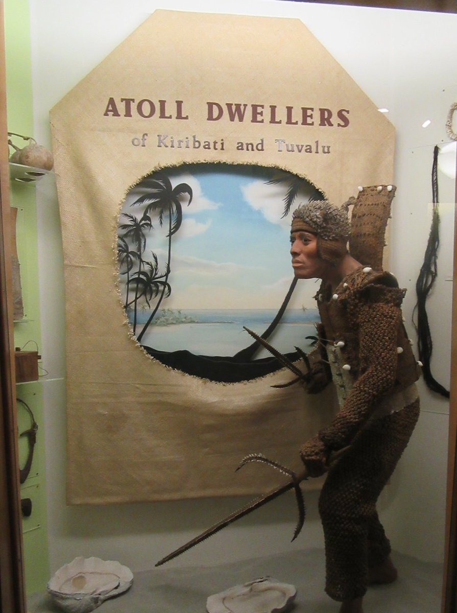 A favourite with a lot of visitors, Kiribati warrior wearing, coconut matting armour, a porcupine fish helmet, and shark skin stomach protector 5/
