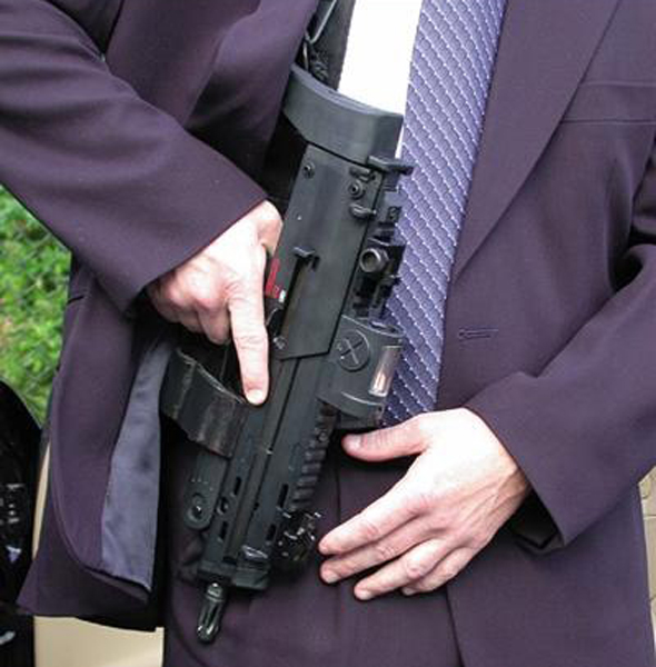 They have weapons such as Heckler and Koch MP7s under their robes.