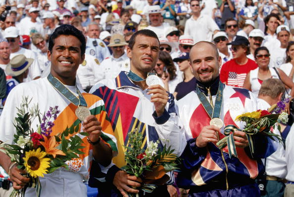  @Leander lost a close 2 set game to eventual gold medalist and one of the greatest tennis players of all time  @AndreAgassi Here's the podium at the 1996 Atlanta Olympics. Don't all the medals look the same? Asking for a friend.