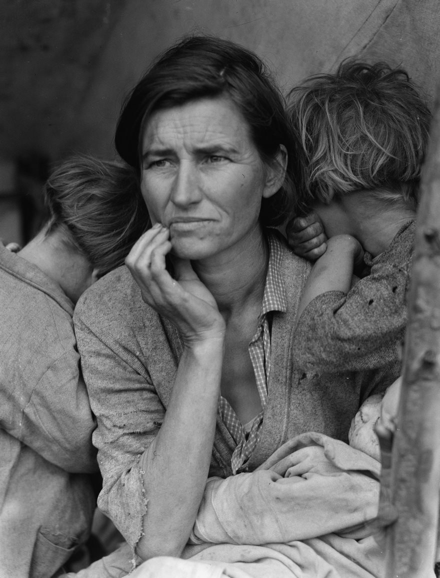 21/In 1936, during the peak of Great Depression, Florence Owens Thompson aged 32, was living in a tent with seven children. Thompson looks on, determined but weary, while her children turn their faces away.
