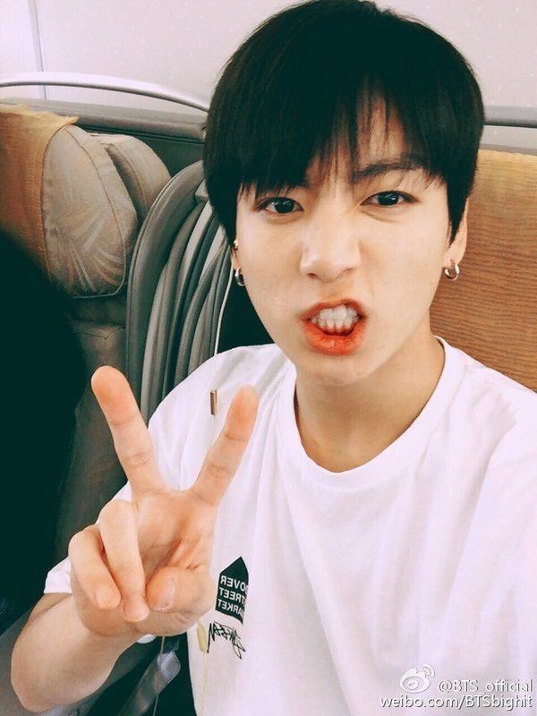 Jungkook with V( or Peace sign) a thread :
