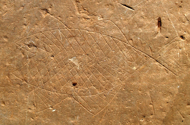 (3/8) Two fish were carved on two pavement slabs, one of them with a large open mouth. Researchers believe they may be in the salmon family. Next to one of them appear some mysterious strokes similar to an unknown writing, but do not hesitate with that!  #hillfortswednesday