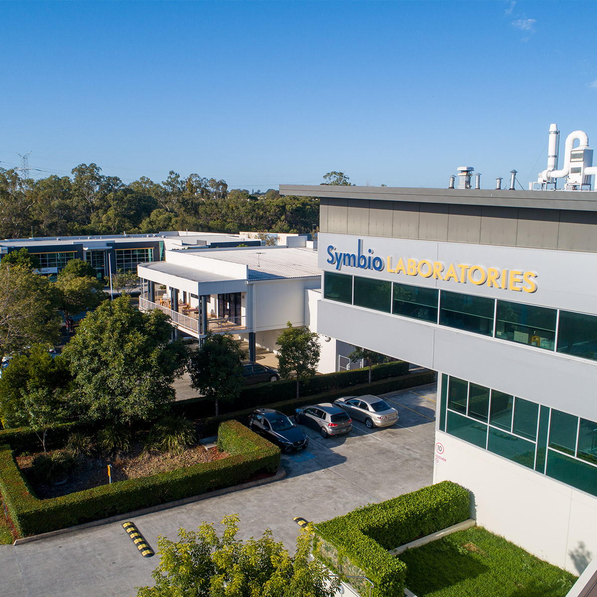SymbioLabs's tweet photo. In May, Symbio Laboratories' Brisbane site partnered with Green Sky Drone photography to take some aerial shots of our 44 and 52 Brandl Street sites. We're absolutely thrilled with how they turned out and wanted to share a sneak peek of this new drone footage. https://t.co/5up3fl0mCD