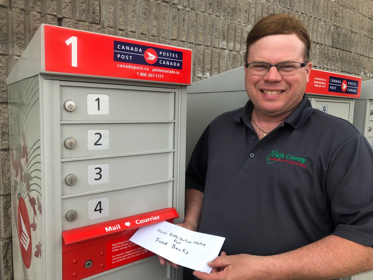 PerthCountyAg's tweet photo. President Tim Halliday , mailing a donation from #PCFA2020 to the Huron County Food Bank Distribution Centre &amp; @HCFBDC staff members Marg Deichert &amp; Sharon McNeilly with our  $1,000 donation for food and agency clients in Huron and Perth Counties. #FarmersToFamilies https://t.co/J9kByVe95x