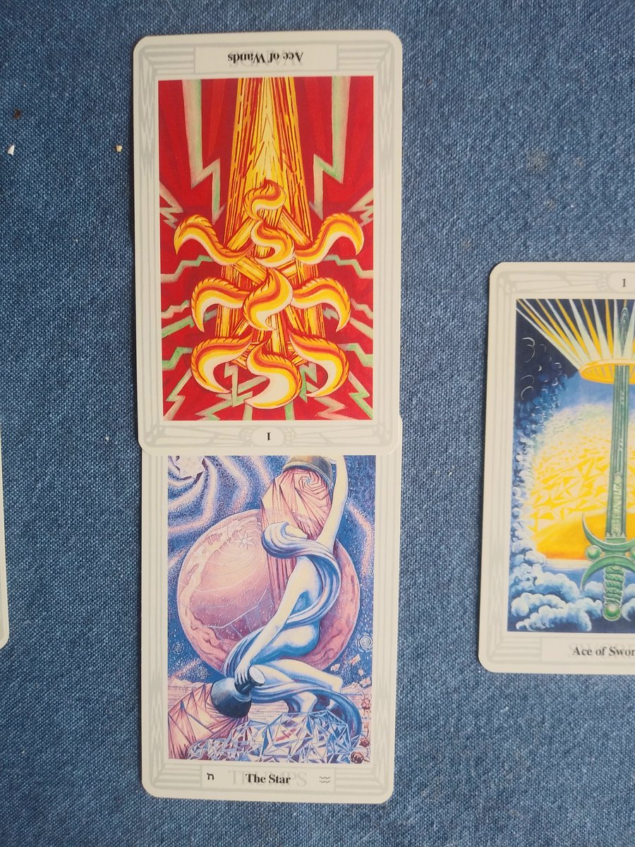 the middle cards represent the "core" or "heart" of the situation and challenges or influences on the samesituation: The Starinfluence: inverted Ace of Wands
