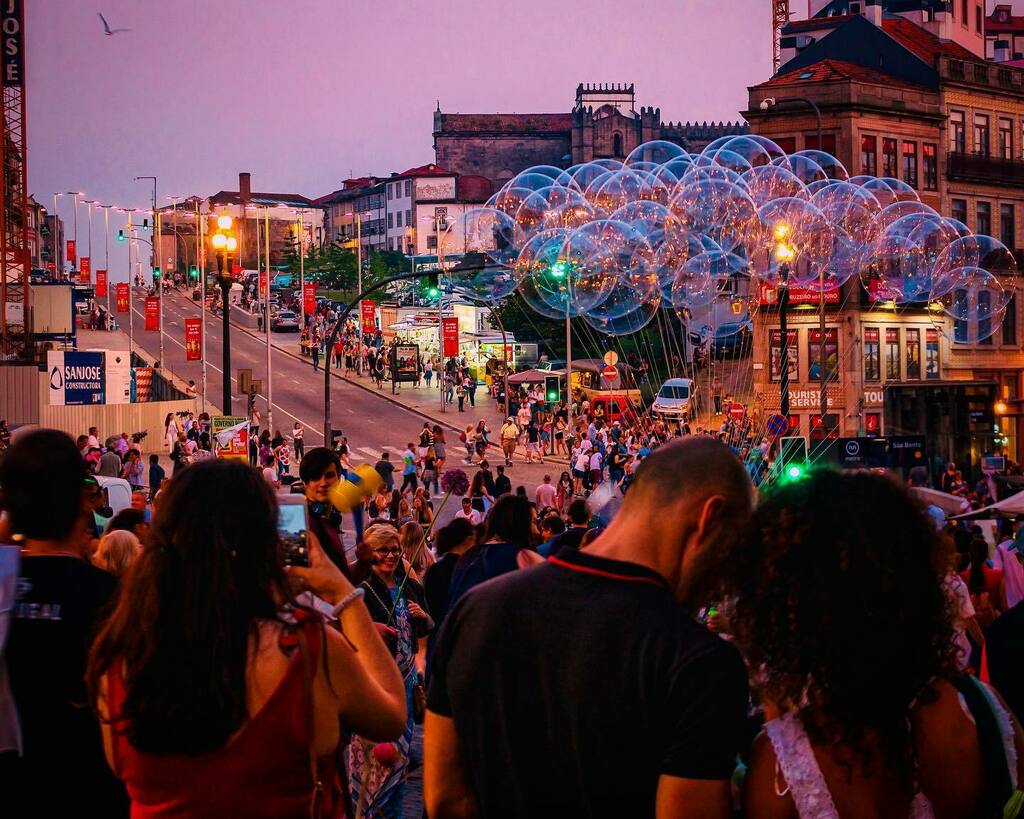 anuragsvr's tweet photo. Porto City Council states that the traditional party of São João will not take place this year. I looked for some old photos of São João from 2018. I photographed this in front of Sao Bento train station; the way leads to the Ponte Luis bridge where the … https://t.co/Io7k3bmQeH https://t.co/KiMLH8alnP