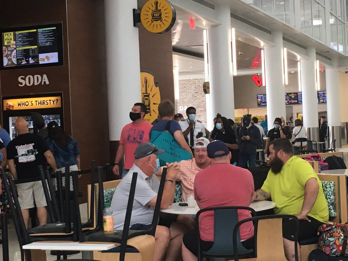 markdag's tweet photo. Dear airport leaders and government dingbats. Here’s what most of @IntlAirportCLT looks like. And here’s what the food court looks like... because more than half the restaurants are closed! Focus people. Goal=social distancing. Stop squeezing people in on purpose!! https://t.co/FNKOJf8RZD