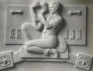 Including James Woodford - who did those fantastic doors at Norwich. At Portland Place he produced these plaster reliefs - in the Swedish style then fashionable - for the Florence Hall. This is a self-portrait in the guise of an electrician. I think it's a 'lightbulb moment'