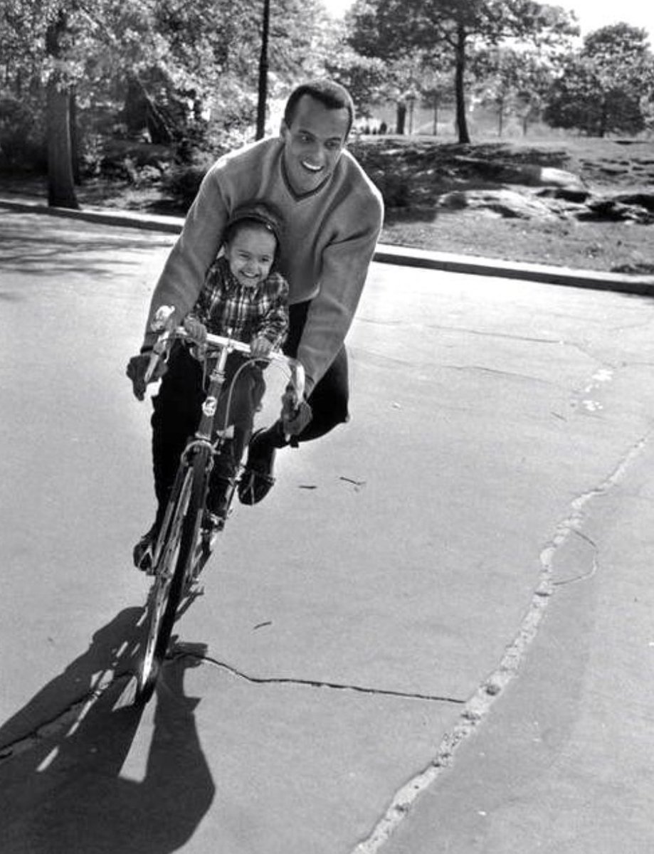 Harry (and Shari) Belafonte ride a bike in 1957 (photo Cornell Capa)