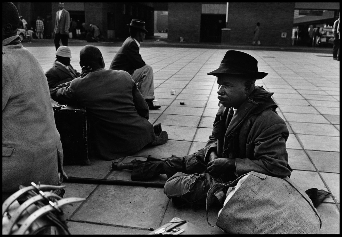 Uprooted from his home and community and divorced from the circumstances that had fired his creative imagination, Cole never found his feet in Europe or America..Johannesburg station, South Africa. 1960. © Ernest Cole