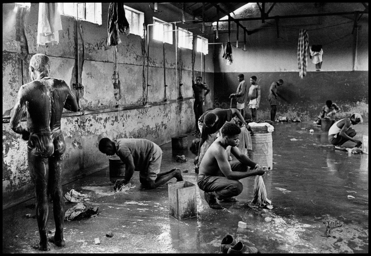 Washing conditions at the mines were primitive. Shower rooms were crowded with men trying to bathe while others did their laundry as they had no means to do it at home. © Ernest Cole