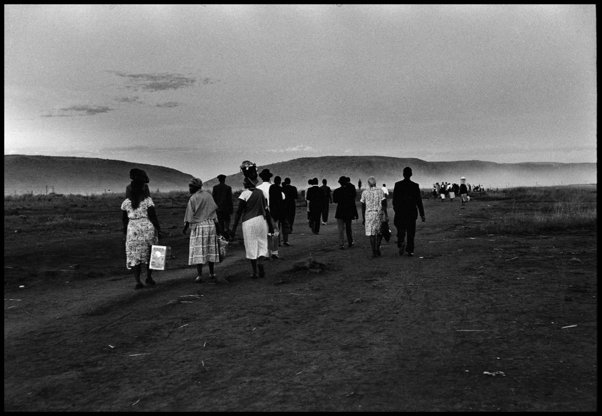 People returning after a long day’s work and a train ride from Pretoria. Mamelodi, South Africa. 1960. © Ernest Cole