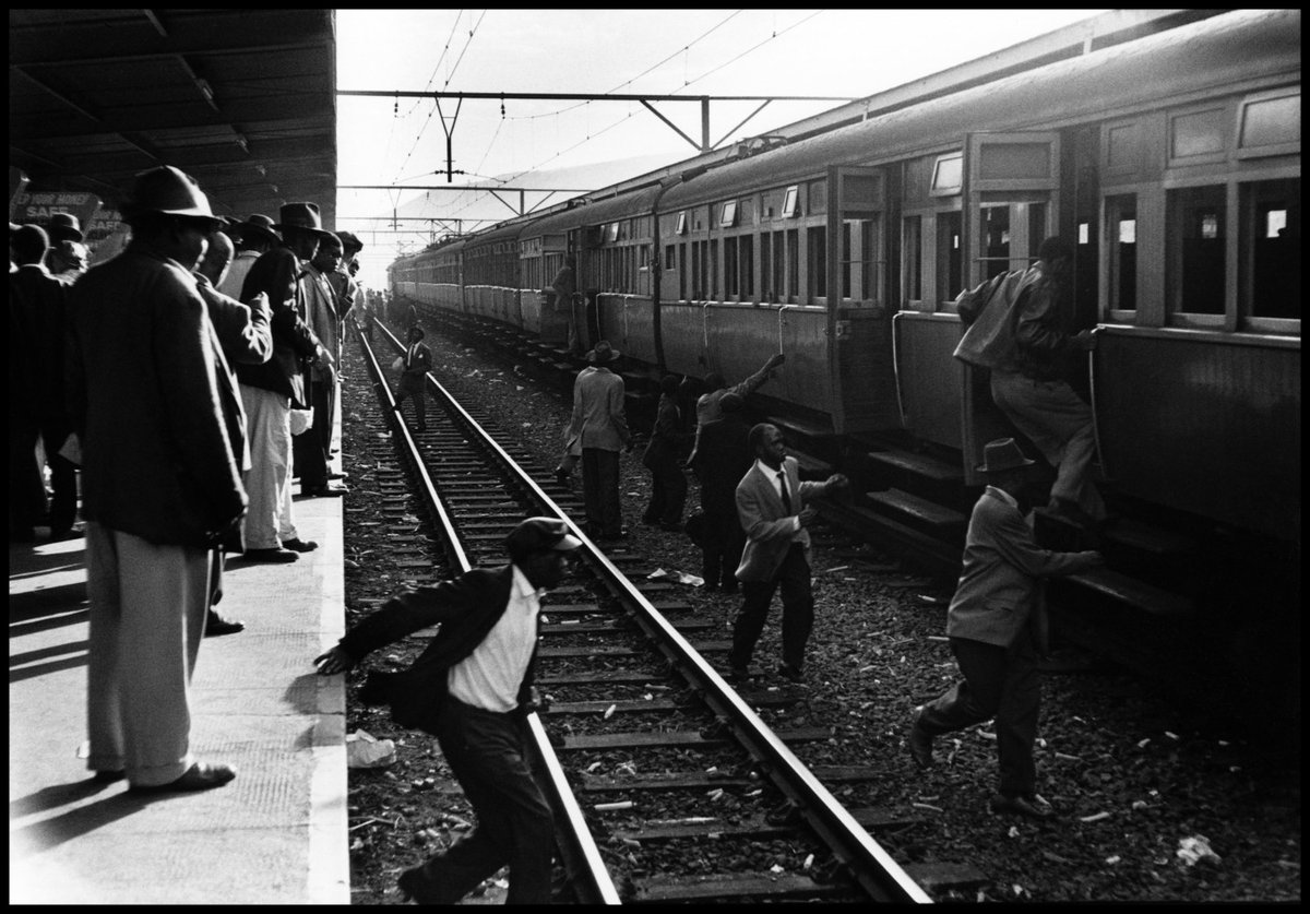 Which black train to take is matter of guesswork. They have no destination signs, and no announcement of arrivals is made. In confusion, passengers sometimes jump across track, and some on occasion were killed by express trains. © Ernest Cole