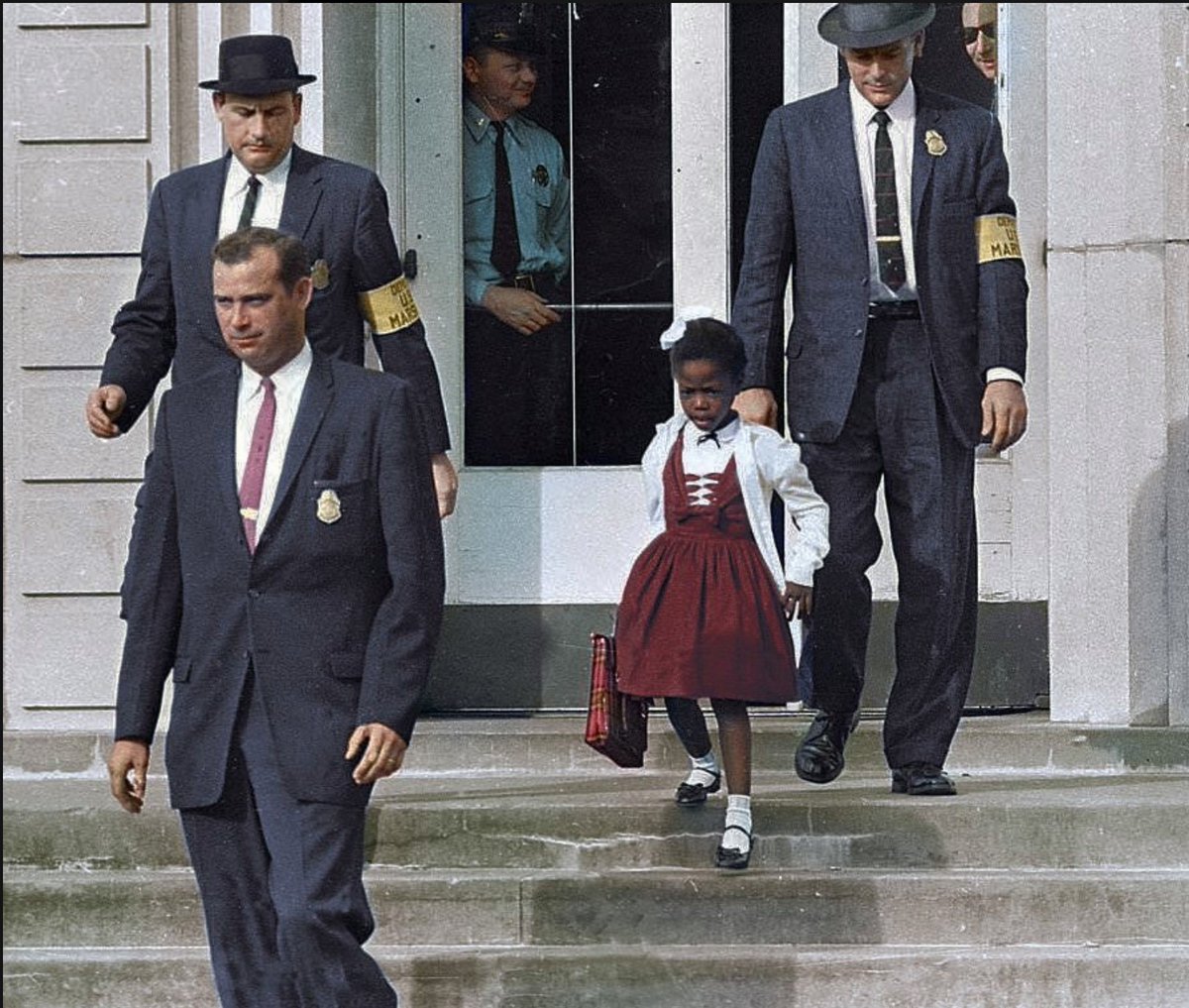 Meet Ruby Bridges. At 6 years old, she was the first Black child to attend an all-white elementary school in the American South. ⁠⁠For her to attend school her first day, federal marshals with guns had to make way through a crowd of grown men and women screaming “n*gger”.