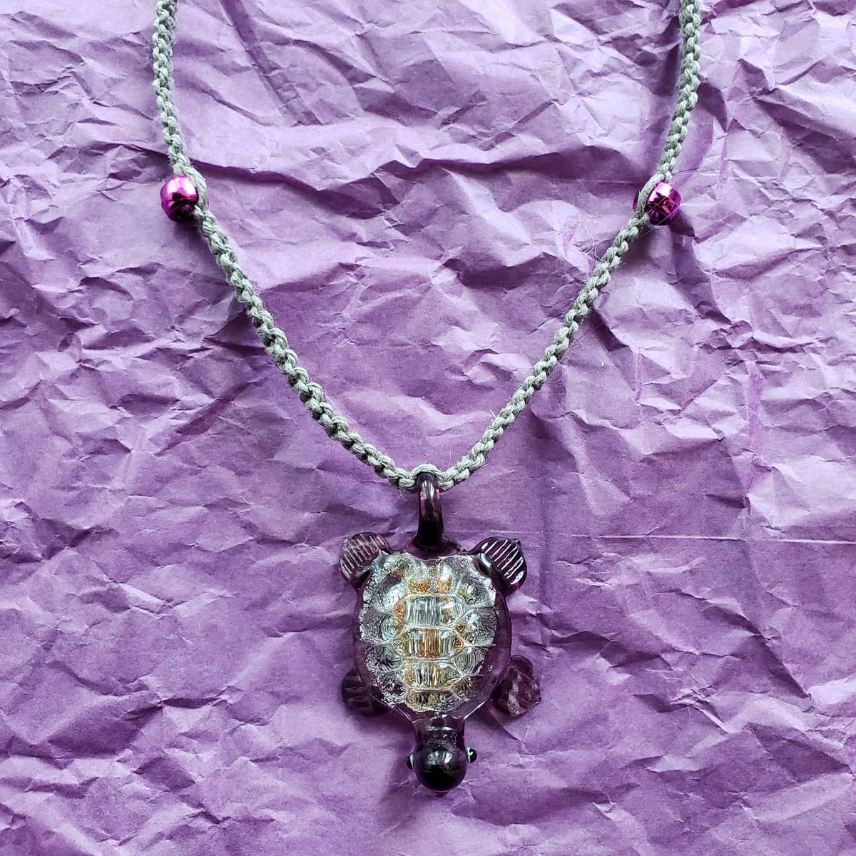 knottyintrovert's tweet photo. Contrast is one of my favorite elements to experiment with when designing; I incorporated this into my latest necklace by pairing a neutral cord with a distinctive focal pendant & candy bead accents 💜🐢 #glassturtle #pendant #macramenecklace #knotty_introvert_creations https://t.co/RrmATjEPAf