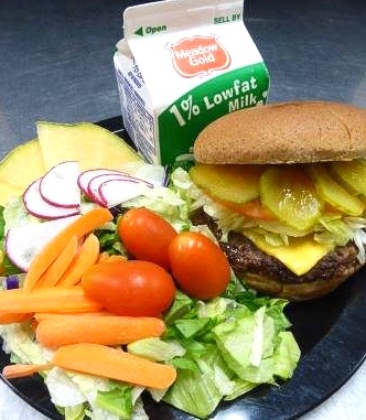 PSDNutrition's tweet photo. Lunch service at Riffenburgh today includes hamburgers or cheeseburgers! Our beef patties are 100% beef with no fillers and served on a local whole wheat bun! Served with fresh grapes and carrots and Colorado local milk! #supportcolorado #localingredients #cleanlabels https://t.co/wteQ6SbYBf