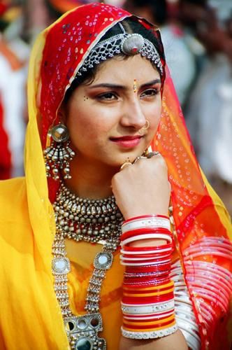 you see what's on their head??? that jewellery piece is called maang tikka and has different names in different parts so when when we see any non south Asians wearing it we call it "desi ca" 