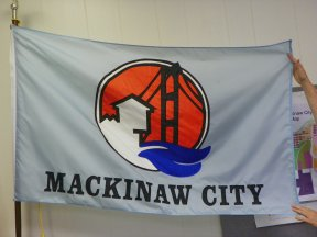  My sincerest apologies to the village of Mackinaw City, MI. The flag I posted is merely an official city "winter sign" required to be printed on a rectangle of nylon fabric. Thanks to the intrepid reporting of CRW flags for uncovering the TRUTH https://www.crwflags.com/fotw/flags/us-mimkw.html