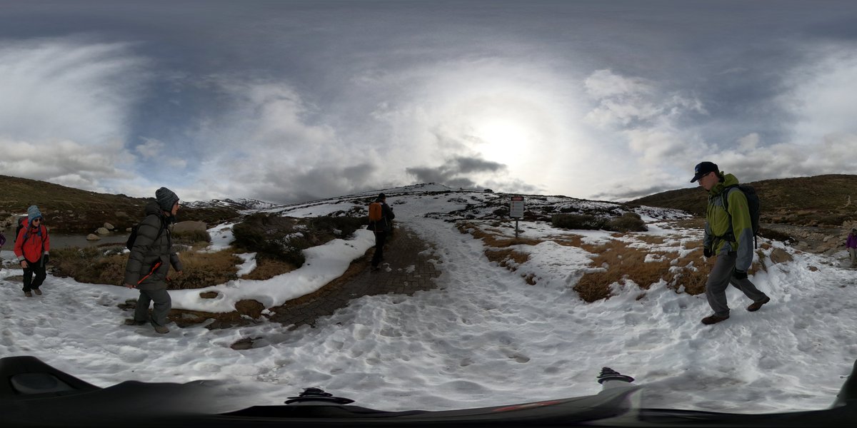 scientists climb snowy mountain