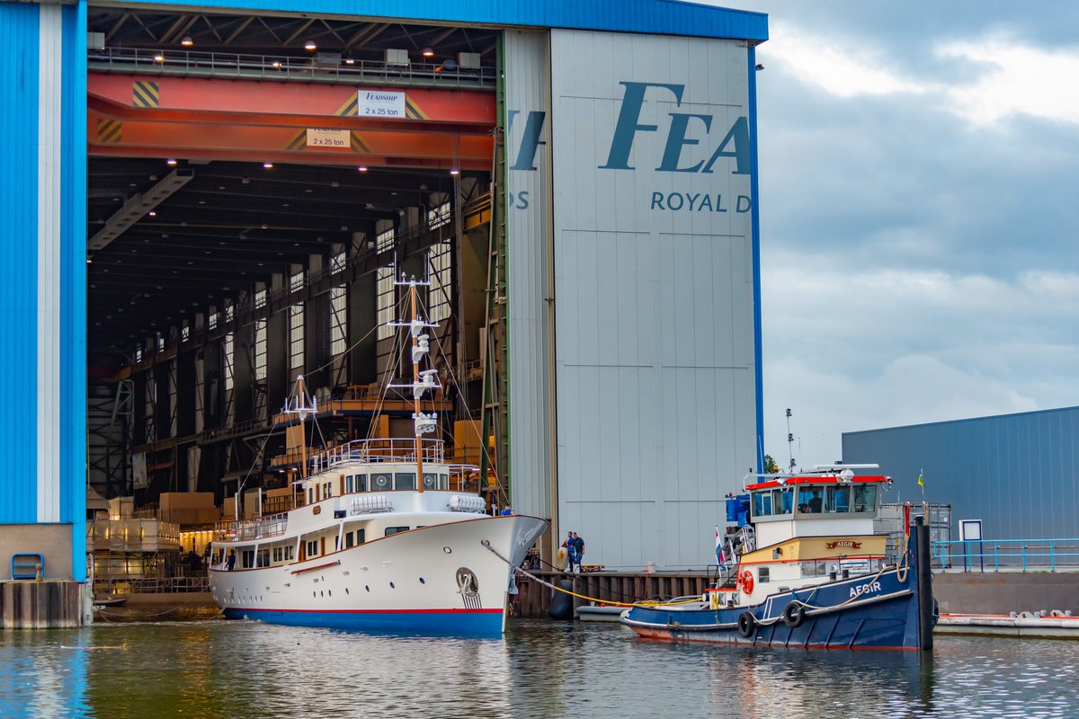 Feadship's tweet photo. After a year of intensive cooperated effort of all parties involved, she is ready again to show her magnificent lines. #Istros will be entering her final completion phase at the #Feadship yard while afloat and will be revealed this summer. More at: https://t.co/lyPt9Eiixq https://t.co/MMI9YTDg06