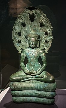 Mucalinda is shown protecting "Buddha" which is depiction of Naga king protecting Buddha ,In SE art it's Dragon shown protecting Buddhism