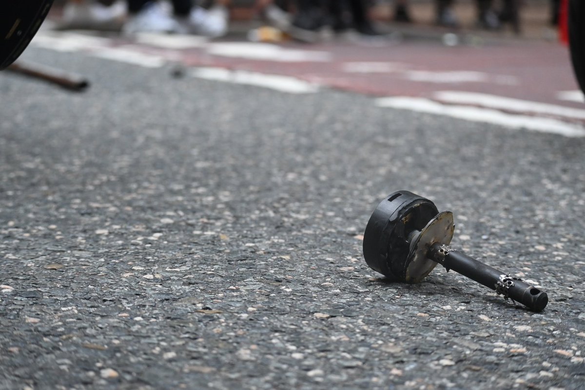 A CS hand grenade has been deployed. Y the police, sub-munitions and debris litter the floor.