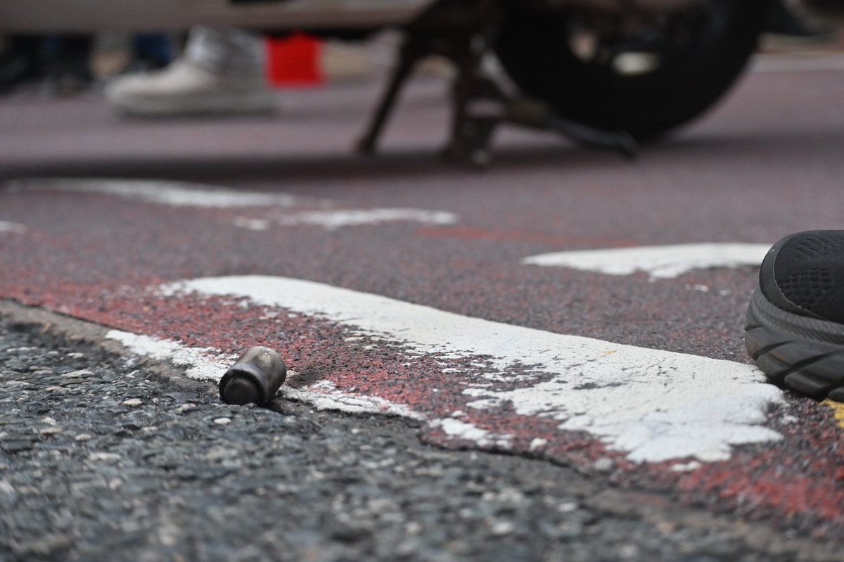 A CS hand grenade has been deployed. Y the police, sub-munitions and debris litter the floor.