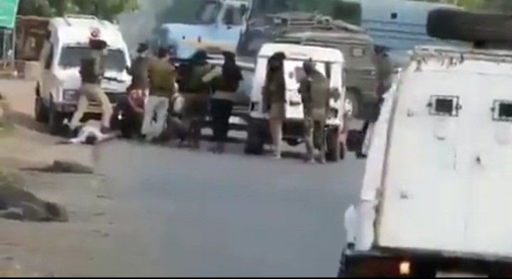 BhatAam786's tweet photo. An Indian army personnel standing over the dead body of the innocent civilian killed in the crossfire between the army and militants 
At least respect us when we're dead 
#sopore
#KashmirBleeds https://t.co/a0BKYPISlj