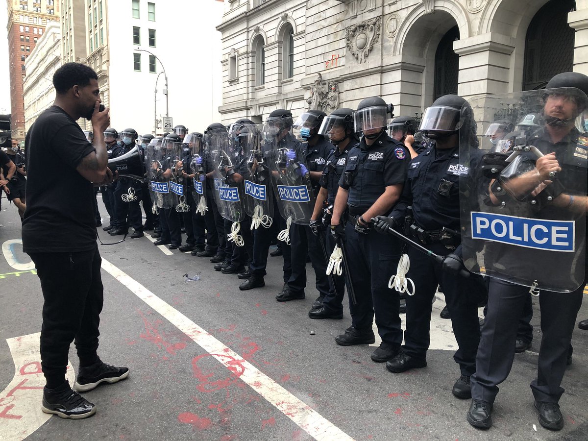 After having taken the nearby roadways last night, activists are back in the plaza, with arms linked, several feet away from rowd of NYPD officers