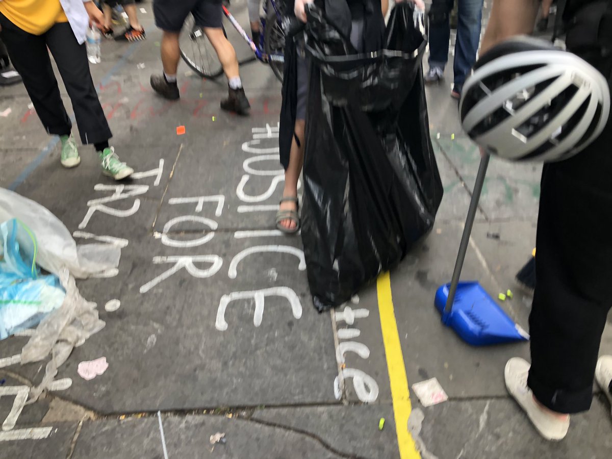 Tensions diffused for now, folks fall back into the plaza, some are picking up trash from night before.