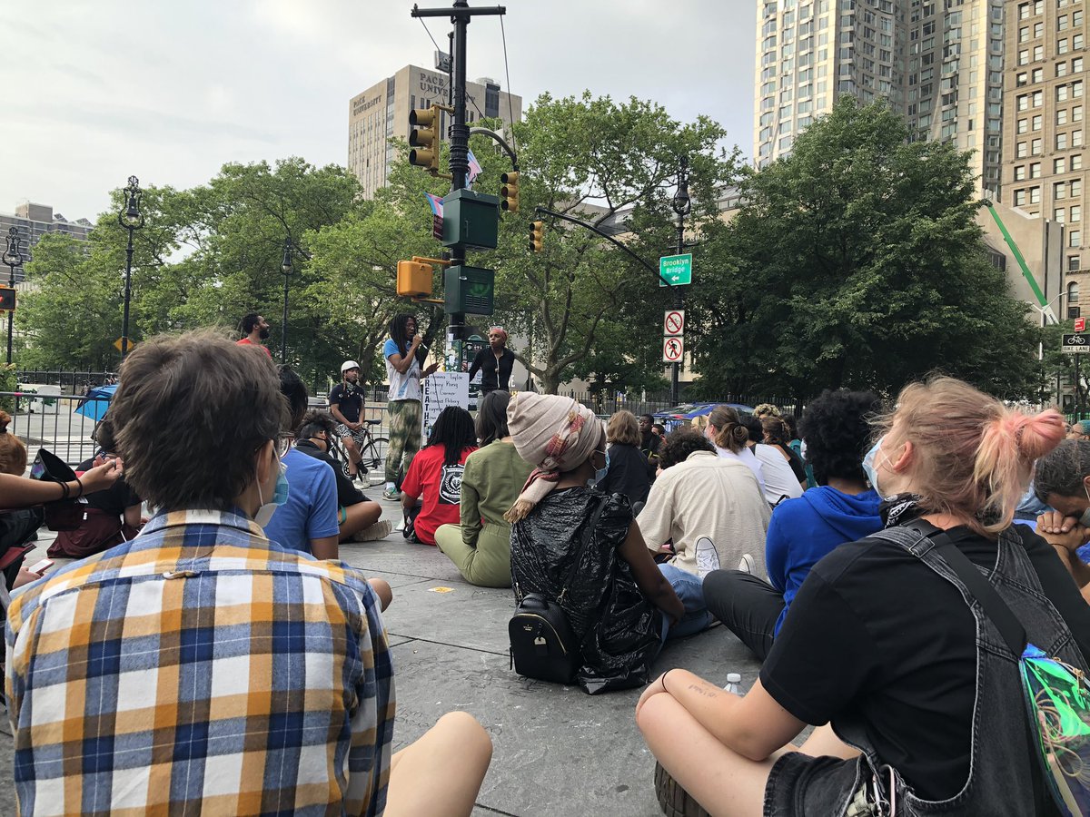 To fully capture the 180 in mood at  #OccupyCityHallNYC someone is now leading meditation and breathing exercises.. a few minutes ago they were prepared for a battle.