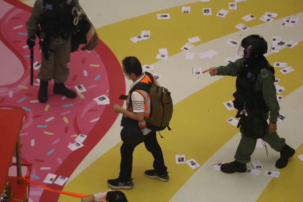 Police have blocked off Times Square to conduct stop and search. Leaflets doxxing officers are scattered around the atrium of the luxury mall in Causeway Bay.
