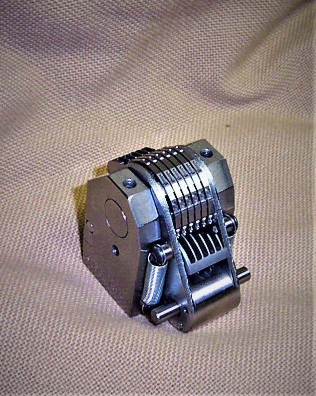 Here's a picture of a modified Model 50P.  Customer needed to fit a 5/32" , 6 wheel, Model 50P into a small area. Wheels are extra condensed, frame has been trimmed to minimum dimensions.  Extension springs are used in place of coil return springs.  It fit perfectly! Made in USA!