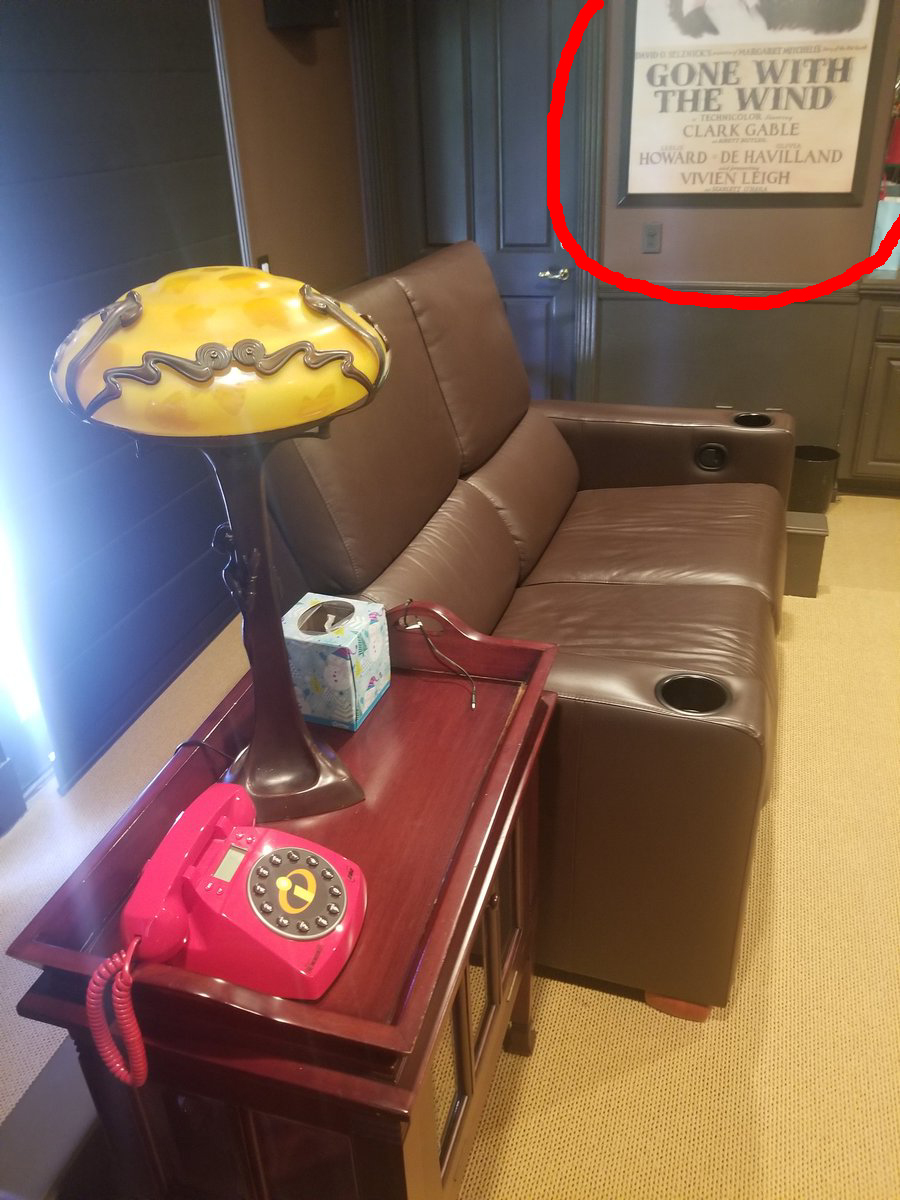 HOLY , Batman!  @bigredwavenow. Chachi shares a pic of the Incredibles phone; Santa ReTweets post & says the  #Batphone is Cool Too. View Chachi's full pic & it shows Gone With The Wind movie poster. (creepy lamp, btw)