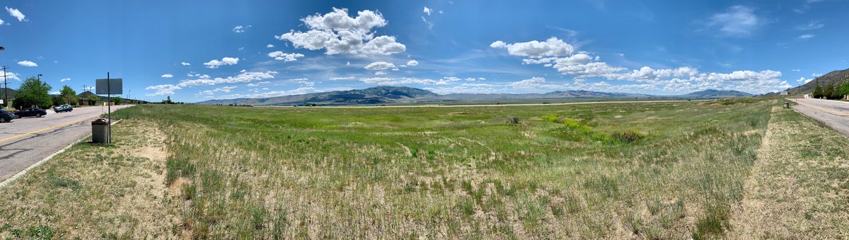 16/ We then sprinted to West Yellowstone to visit the park the next day. You don't need my camera-phone wildlife photos, so instead here is (a) a panorama of the valley in eastern Idaho we drove through; (b) a funny sign; and (c) a great mid-century motel sign in West Yellowstone