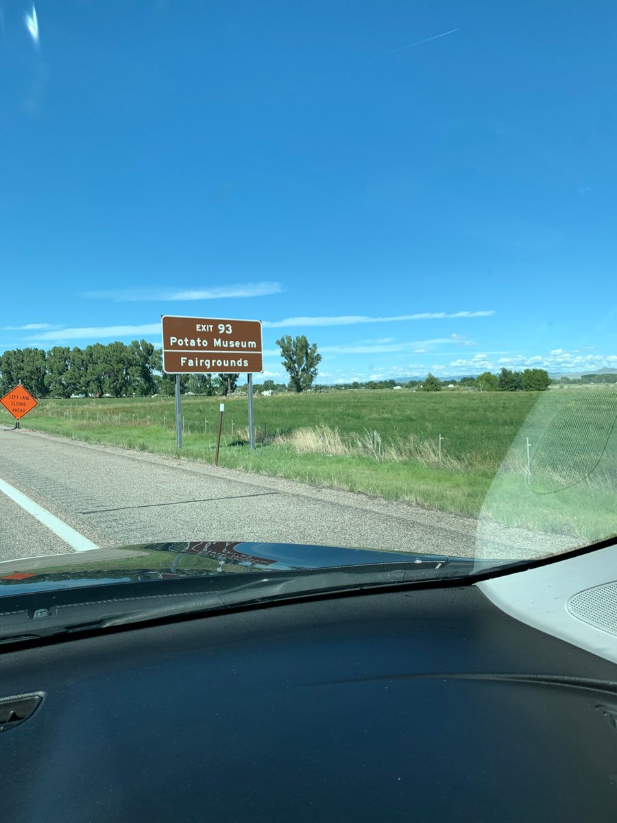 16/ We then sprinted to West Yellowstone to visit the park the next day. You don't need my camera-phone wildlife photos, so instead here is (a) a panorama of the valley in eastern Idaho we drove through; (b) a funny sign; and (c) a great mid-century motel sign in West Yellowstone