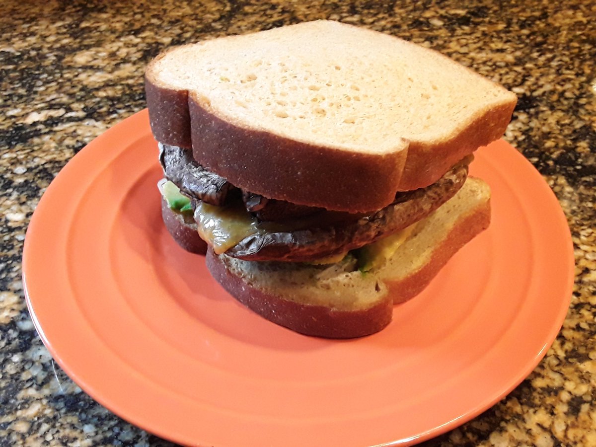kakercookery's tweet photo. rainy day shroom burger with cheddar and swiss, avocado, tzatziki, honey mustard, and pickles. 320 calories, 16 protein #mushrooms #kakercookery https://t.co/ktQUCqxcBG