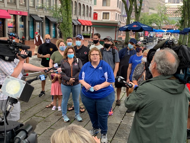 FaneuilHall's tweet photo. Linda DeMarco, President of the Faneuil Hall Merchants Association and Owner of Boston Pretzel, addresses the press during the reopening of Quincy Market this morning. Nearly 50 local businesses opened in unison today after being closed for 3 months. @FaneuilHall @BostonPretzel https://t.co/MoKLO4qGam