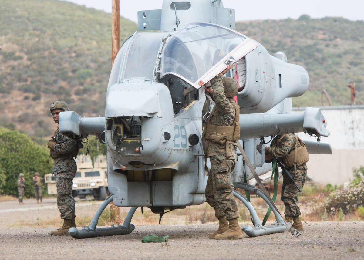 PacificMarines's tweet photo. #Marines with #MWSS373, @3rdmaw prepare and transport a training #helicopter during an aircraft recovery exercise at @MCASmiramarCA, employing #EOD technicians, heavy equipment operators, motor transport personnel and combat engineers without the aid of outside resources. https://t.co/KopngUUaxn