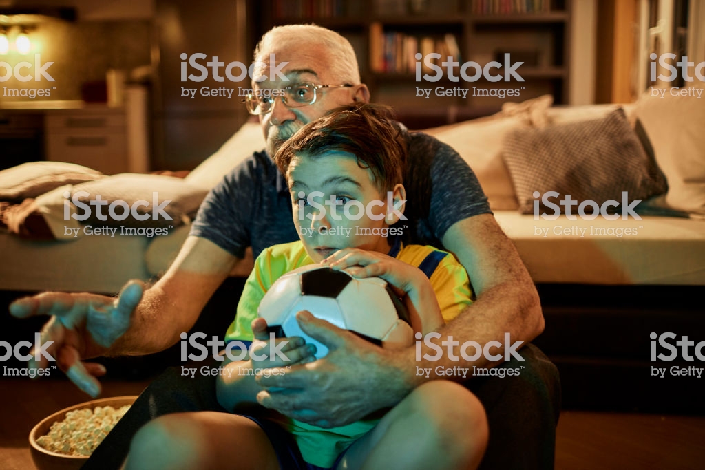 "Grandad, why are we sitting like this?""It's how I watched football with my grandad. It's very normal."