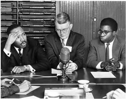 Mr. 'Bola Ige, co-secretary of the 18th Ecumenical Student Conference held at the University of Ohio, Athens Ohio, and The Rev. Martin Luther King jr at the daily news briefing during the conference which took place between December 27, 1959 and January 2, 1960.