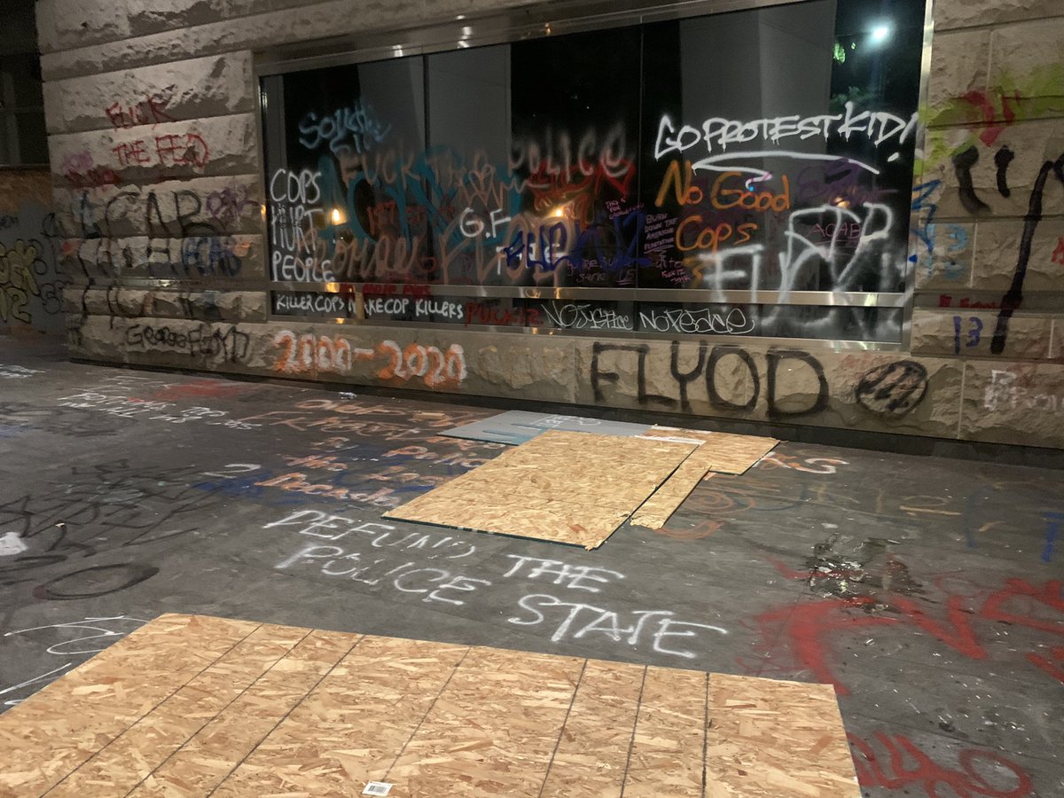 A couple of protestors tore down some of the wood from the courthouse to add to the fire at the elk statue