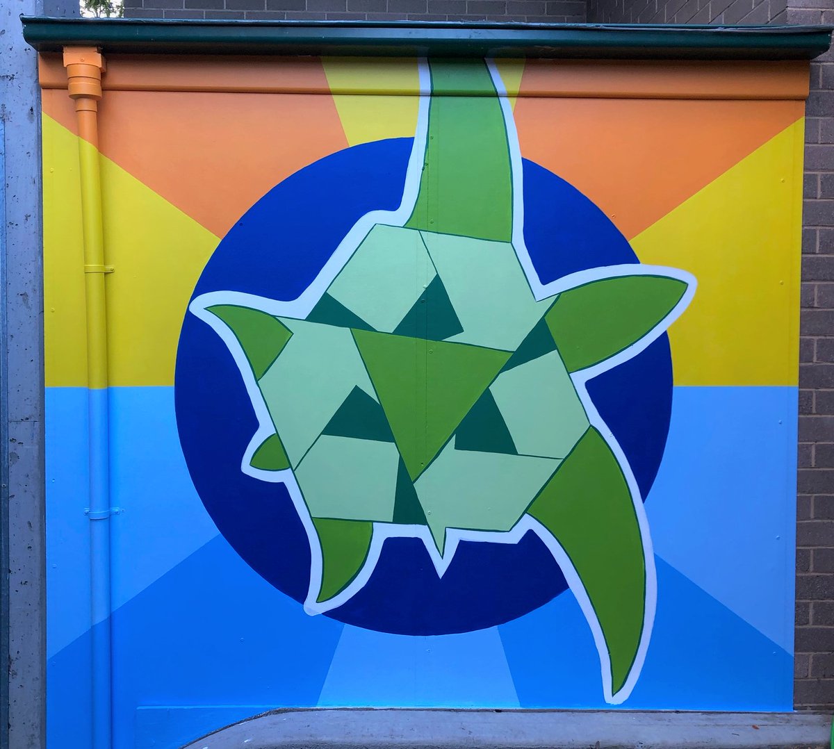 The main panel with the turtle has a blue earth shape backed by sun and sea to represent the oceans and marine life/environment. The turtle has a hint of optical illusion with the recycle-reuse-reduce symbol as the shell. This is the idea of thinking globally. 2/3