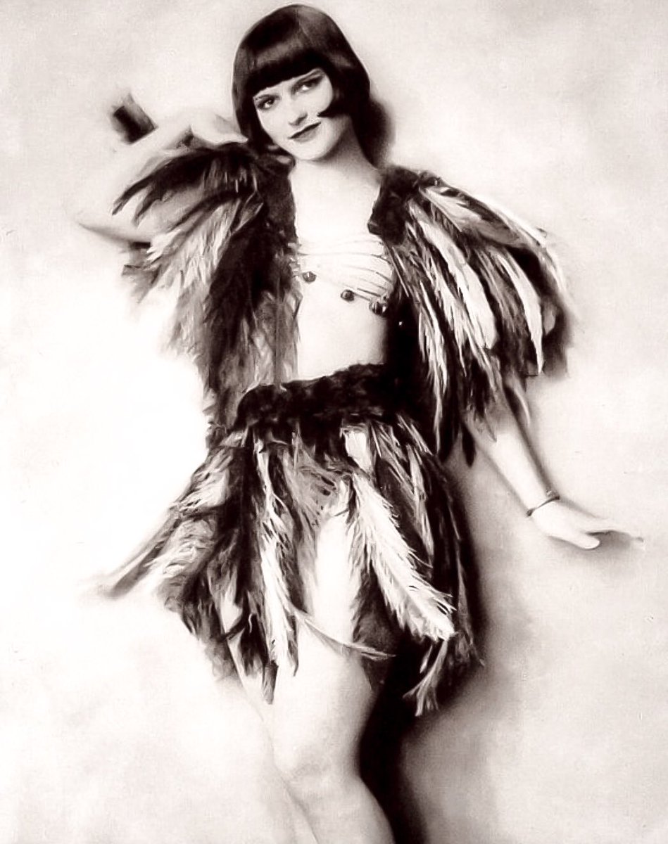 Another photo of Louise and feathers from her “Scandals” days by Johnston shot backstage at the Apollo Theatre in New York. By the time Police Gazette published her photo in December, 1924, she had taken residence alone in a London hotel. She had just turned 18.